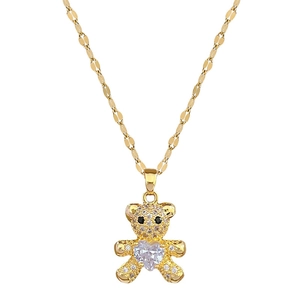 Golden titanium steel necklace with a micro-pave teddy bear pendant and heart stone
