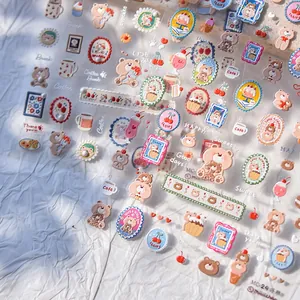 Macro view of 3D bear and coffee themed nail art stickers with relief texture effects