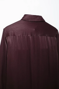 Detailed view of dark burgundy satin shirt collar and high-quality back shoulder stitching