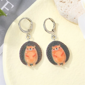 Cute hedgehog animal earrings with orange and dark grey tones and silver leverback hooks