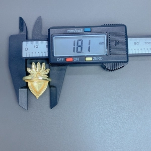 Detail shot showing heart crown ring inner diameter measurement at 18.1 mm with caliper