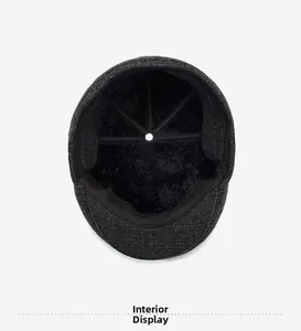 Detailed view of the warm faux fur lining inside the grey plaid winter flat cap