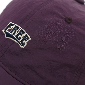Macro shot of waterproof fabric with water droplets and FREE embroidery on baseball cap