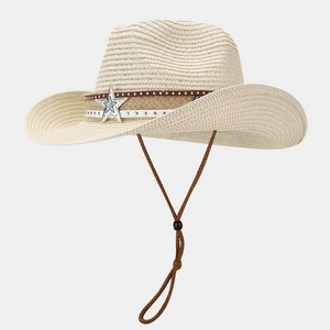 Detail of woven straw cowboy hat with vintage star pendant and adjustable chin strap
