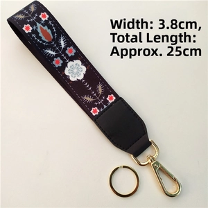 Detail of ethnic floral embroidery strap with gold lobster clasp and key ring, width 3.8cm