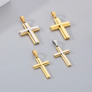 Detail view of double-layered stainless steel cross pendants in gold and silver finish