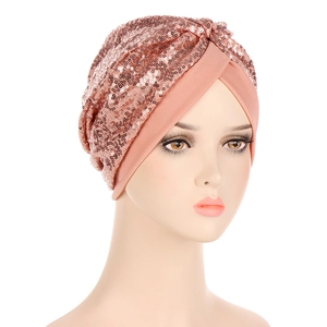 Detailed view of rose gold sequin turban hat with elegant cross-knot design and elastic fabric
