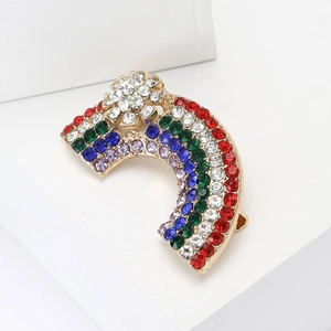 Colorful rainbow rhinestone brooch with gold metal base and small flower detail
