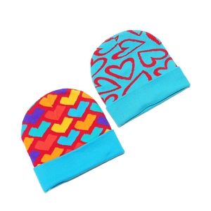 Winter knitted beanie hats with colorful heart jacquard patterns and blue folded cuffs