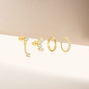 Detailed macro view of 4-piece S925 sterling silver gold earrings set with cubic zirconia
