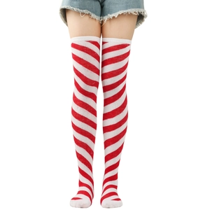 Detail view of red and white striped over-knee high socks in elastic knit cotton fabric