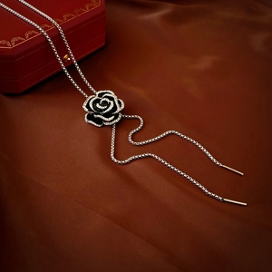 Vintage camellia necklace with black dripping oil and zircons on a silver chain