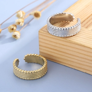 Minimalist gold and silver adjustable titanium steel rings with beaded tire texture