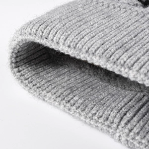 Chunky ribbed grey knit beanie with ear protection and warm fleece lining for winter wear