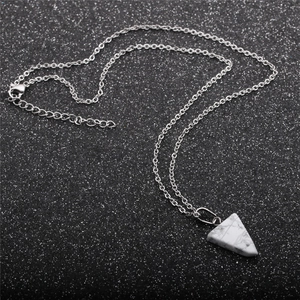Silver chain necklace featuring a white marble textured triangle semi-precious stone pendant