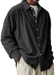 Detail of charcoal grey corduroy shirt showing vertical texture and white buttons