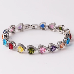 Macro detail of heart-shaped multi-color cubic zirconia bracelet in silver setting