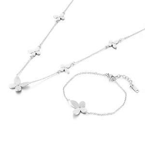 Silver four-leaf clover jewelry set with necklace and bracelet featuring small crystals