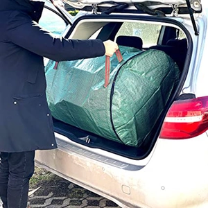 300L heavy duty garden waste bag with lid being loaded into a car trunk