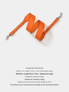 Detail of orange leather bag strap with silver hooks, width 4cm, adjustable length 102-110cm