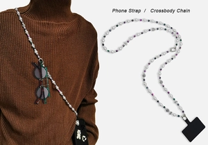 Crossbody pearl phone strap with floral metal accents and colorful beads in use