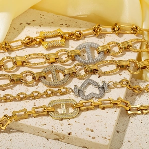 Luxe gold-plated chain bracelets with heart and geometric charms and sparkling zircons