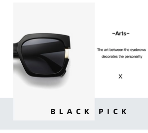 Close-up of black square sunglasses with side gold metal accents and sleek aesthetic