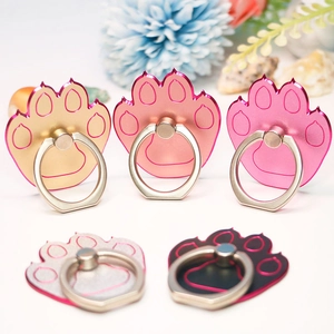 Detail view of cat claw shaped metal phone ring holders in gold silver and black colors