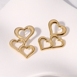 Minimalist gold stainless steel stud earrings with three linked heart cutouts for women