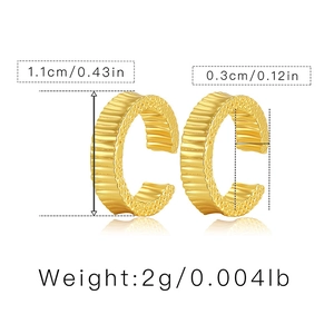 Detailed view of gold C-shaped ear cuffs with vertical texture and precise dimensions
