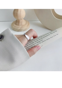 Polished S925 sterling silver Mobius twist ring shown on finger with minimalist styling