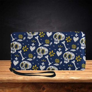 Long leather skull wallet with Day of the Dead floral patterns and black wristlet strap