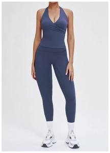Deep blue high-waisted yoga set with racerback crop top and slimming leggings
