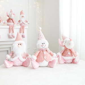 Pink and white plush Christmas dolls featuring Santa, snowman, and reindeer figures