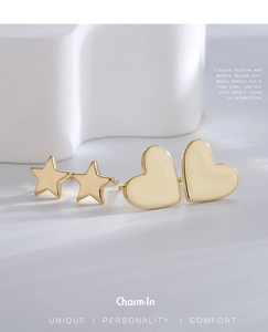 Detailed close-up of gold-plated star and heart stud earrings set with metallic shine