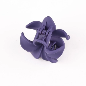 Detailed macro view of the matte purple flower hair claw clip with durable resin petals