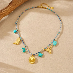 Detail of colorful woven rope necklace with gold pendants and turquoise charms