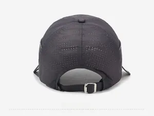 Macro shot of breathable mesh fabric and adjustable metal buckle on dark grey sun cap