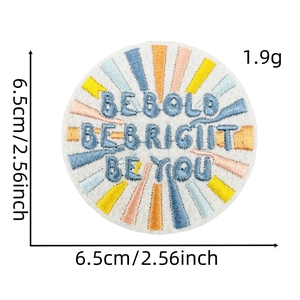 Detail of round embroidered patch with BE BOLD BE BRIGHT BE YOU slogan, 6.5cm diameter