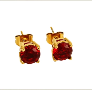 Macro shot of 18k gold plated round ruby stud earrings with four-prong zircon setting