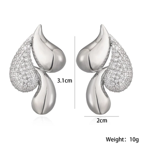 Polished silver abstract leaf drop earrings with white zircon accents in symmetrical view