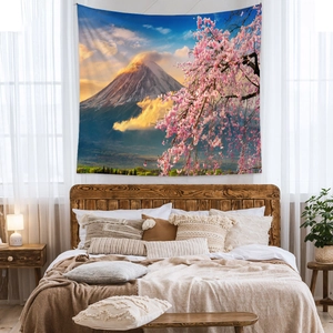 Detail of Mount Fuji tapestry featuring cherry blossoms over a bedroom wooden headboard