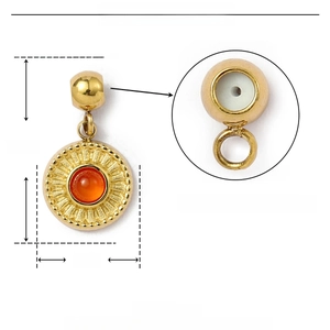 Macro detail of gold stainless steel pendant with natural stone and inner rubber stopper