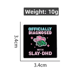 Detail of square frog enamel pin with pink cowboy hat and SLAY-DHD text dimensions
