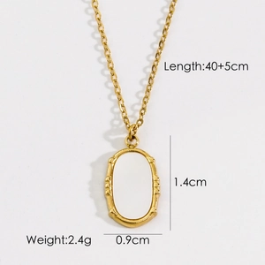 Detail view of oval white shell pendant necklace with measurements 1.4cm by 0.9cm