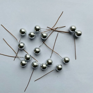 Macro shot of silver berry spheres with stems for DIY floral and holiday decoration