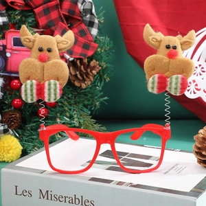 Luminous Christmas reindeer glasses with red frames and plush moose on festive background