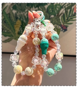 Detailed shot of pastel acrylic beaded phone strap with cute ice cream charms