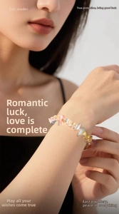 Close-up of a colorful natural crystal stone bracelet worn on a woman's wrist