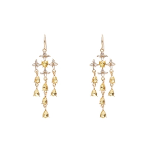 Vintage golden star heart tassel earrings with yellow pear-shaped gemstones on white backdrop